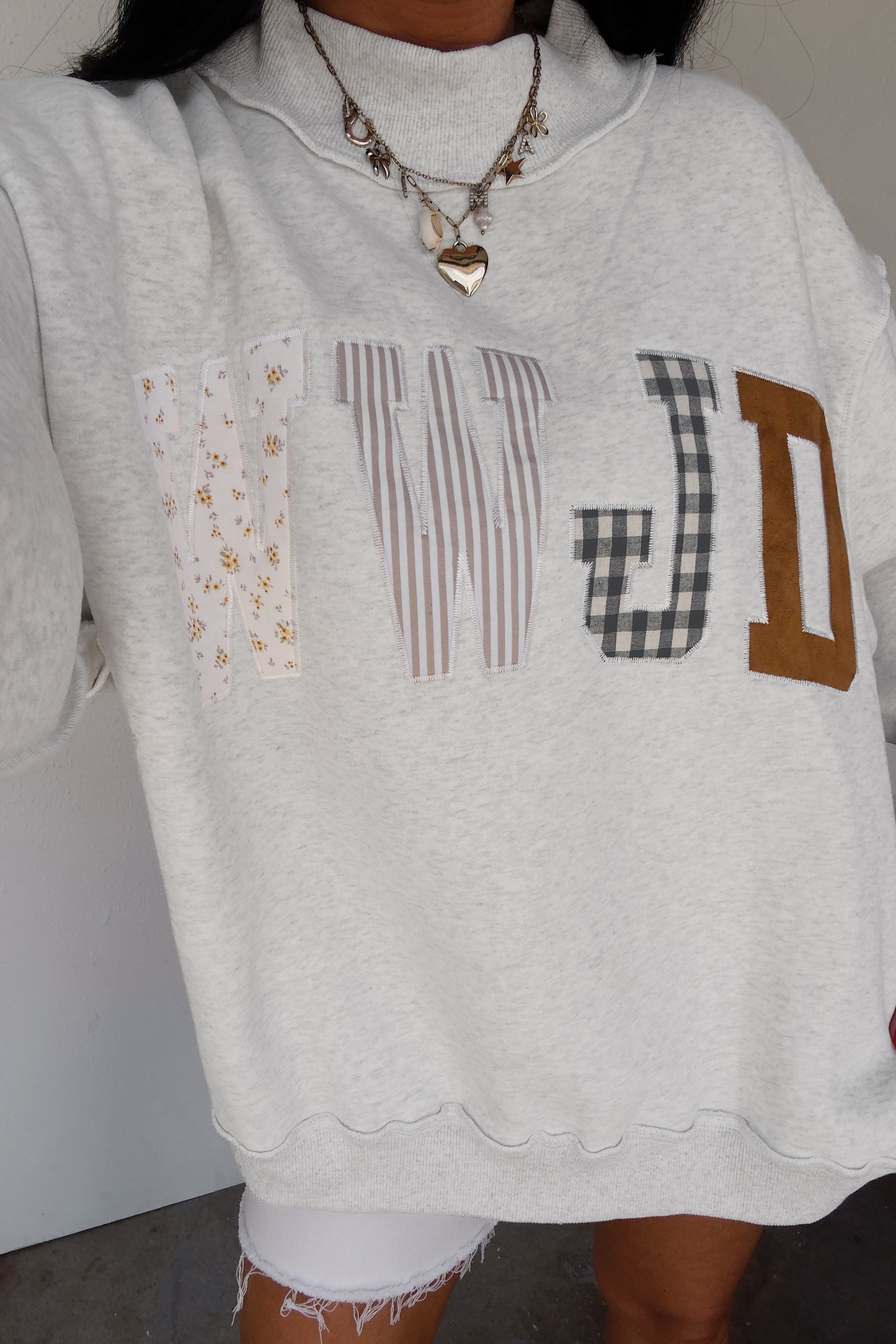 Bonbon WWJD Mixed Pattern Embroidered Patch Graphic Mock Neck Sweatshirt